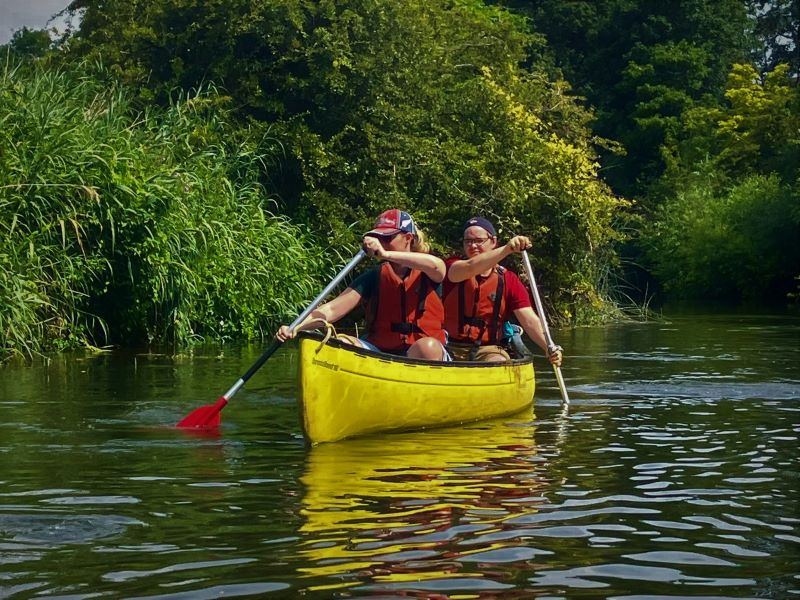 Couple hiring a yellow canoe on the River Ouse