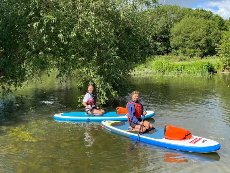 Paddle board hire by two young ladies in bedford